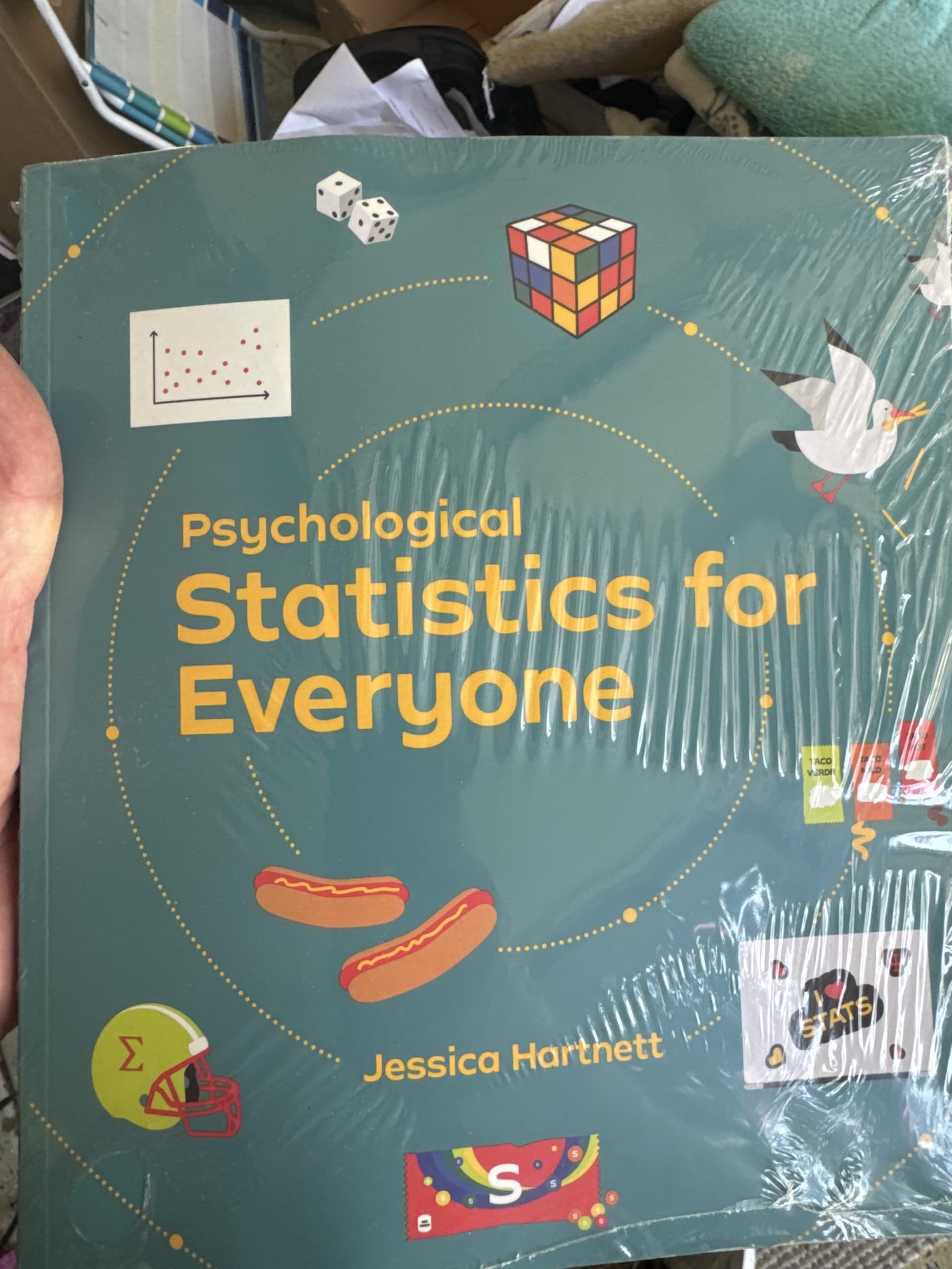 Cover of Psychological Statistics for Everyone by Jessica Hartnett, Educational Statistics Textbook